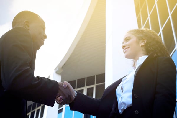 businessman-businesswoman-shaking-hands